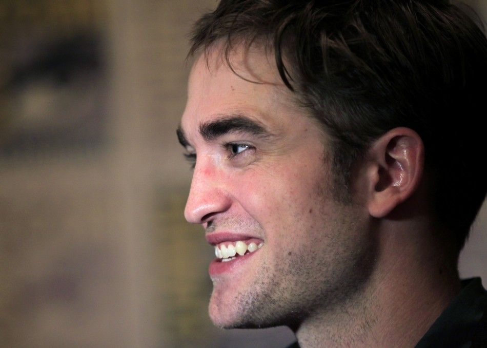 Robert Pattinson poses to promote quotBreaking Dawnquot from the Twilight Saga at Comic Con in San Diego