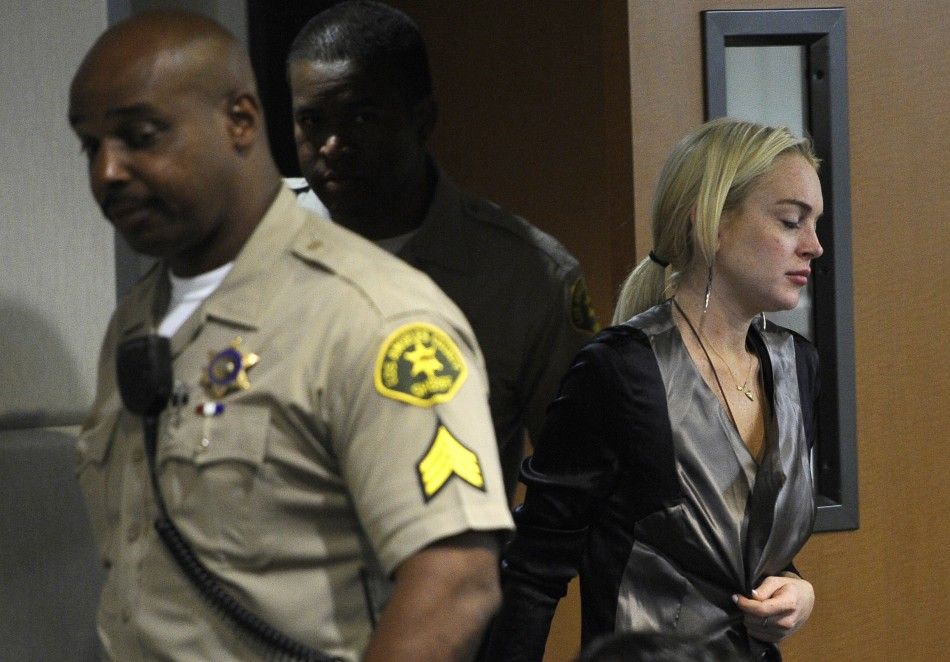 Actress Lindsay Lohan arrives in court for a compliance check in Los Angeles