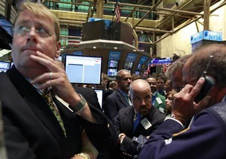 Traders gather on the floor of the New York Stock Exchange