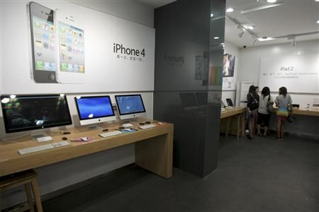 Customers select products in the fake Apple Store in Kunming, Yunnan province July 22, 2011.