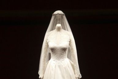 The wedding dress of Britain's Catherine, Duchess of Cambridge is seen as it is prepared for display at Buckingham Palace in London