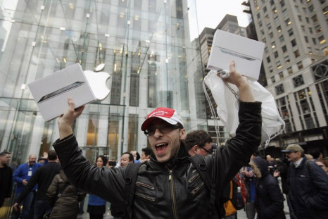A customer holds up a pair of Apple's iPad 2