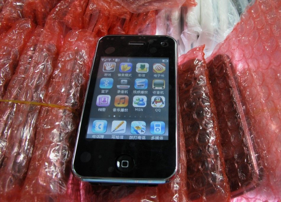A counterfeit iPhone is shown at a mall selling electronics in the southern Chinese city of Shenzhen in Guangdong province