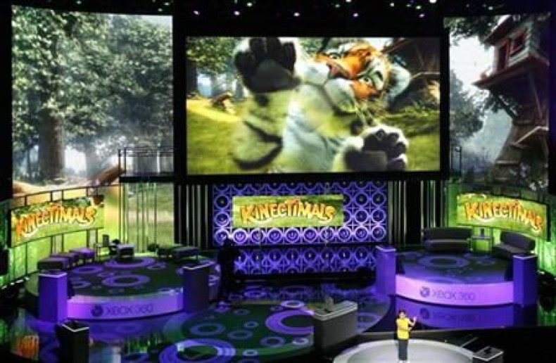 A girl demonstrates the game &quot;Kinectimals&quot; for Kinect for Xbox 360 during a media briefing at the Wiltern theatre in Los Angeles