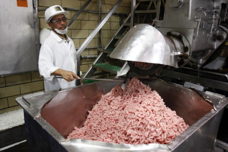 A worker processes turkeys at the West Liberty Food processing plant in West Liberty, Iowa July 7, 2011.