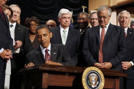 U.S. President Barack Obama signs into law the Dodd-Frank Wall Street Reform and Consumer Protection Act at the Ronald Reagan Building in Washington, July 21, 2010.