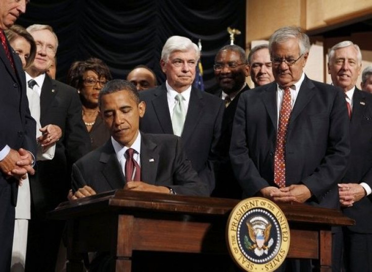 U.S. President Barack Obama signs into law the Dodd-Frank Wall Street Reform and Consumer Protection Act at the Ronald Reagan Building in Washington, July 21, 2010.