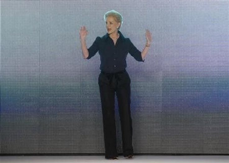 Designer Carolina Herrera acknowledges the crowd after showing her Fall/Winter 2011 collection during New York Fashion Week