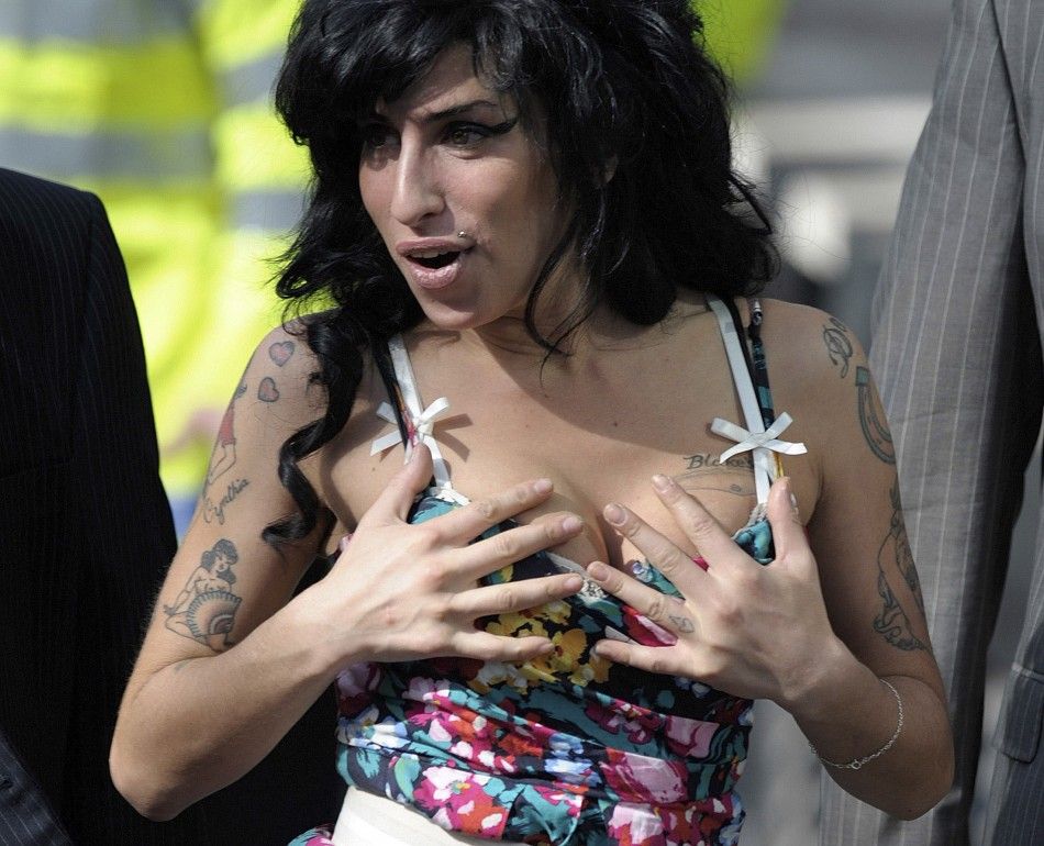 British singer Amy Winehouse arrives at the City of Westminster Magistrates Court in central London March 17, 2009