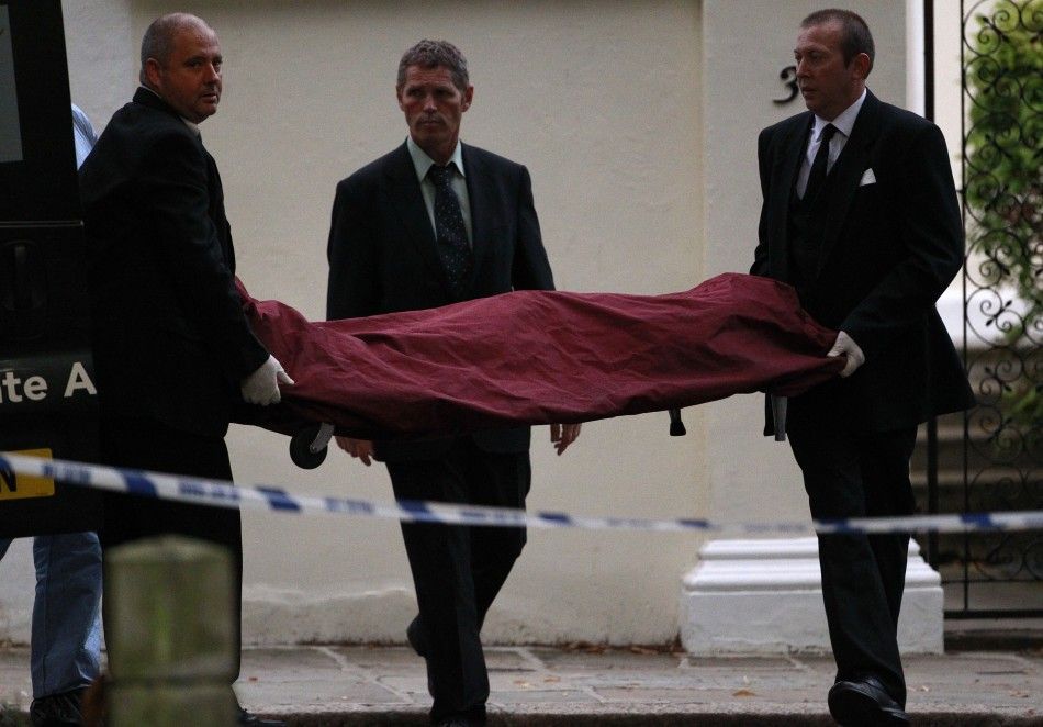 Amy Winehouse Dies at 27, Funeral workers carry the body of Amy Winehouse outside her house in London