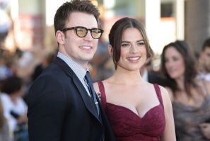 Evans and Atwell pose as they arrive at the &quot;Captain America: The First Avenger&quot; film premiere in Hollywood
