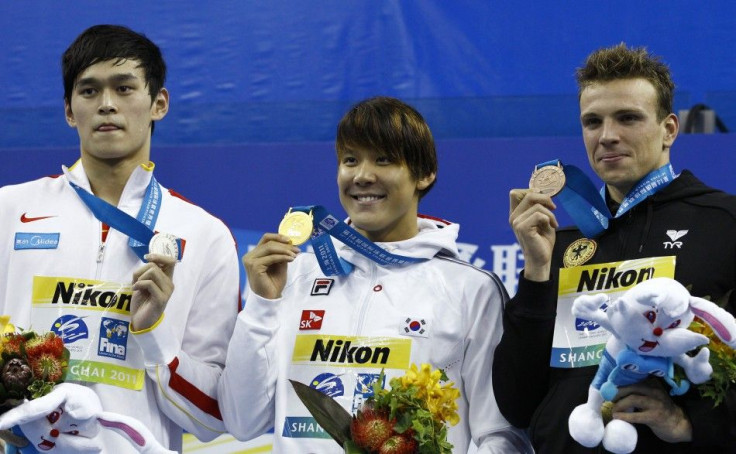 Medallists pose after the men&#039;s 400m freestyle final at the 14th FINA World Championships in Shanghai