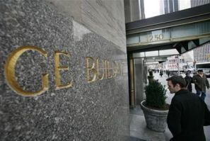 A man enters the General Electric building at 1250 Avenue of the Americas, also known as 30 Rockefeller Plaza in New York