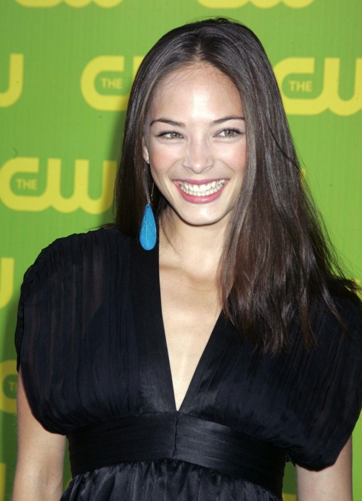 Canadian actress Kristin Kreuk poses as she arrives at the launch party for the CW television network in Burbank.