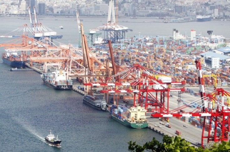 File photo shows container ships docking at a port in Busan