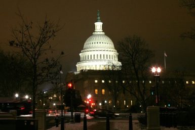 The U.S. Capitol Dome is lit after the first significant snowfall of the season as the House of Representatives worked late into the evening to pass the $858 billion package of renewed tax cuts and more unemployment benefits in Washington