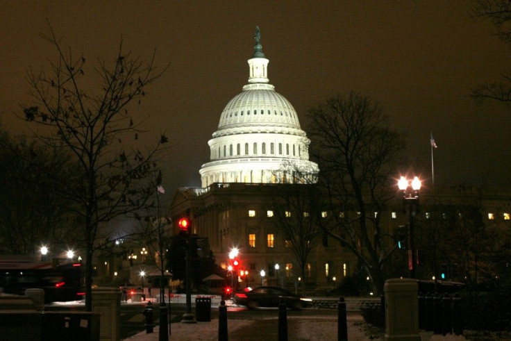 The U.S. Capitol Dome is lit after the first significant snowfall of the season as the House of Representatives worked late into the evening to pass the $858 billion package of renewed tax cuts and more unemployment benefits in Washington
