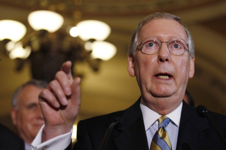 Mitch McConnell speaks to the press following more debt reduction talks on Capitol Hill in Washington