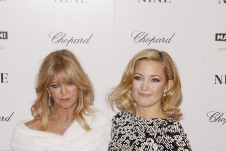 Cast member Kate Hudson arrives with her mother, Goldie Hawn, at the premiere of the film &quot;Nine&quot; in New York.