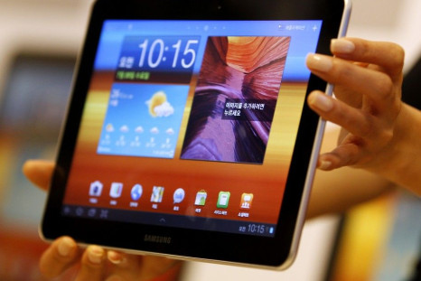 A model holds a Samsung Electronics' new tablet 'Galaxy Tab 10.1' during its launch ceremony at the firm's headquarters in Seoul