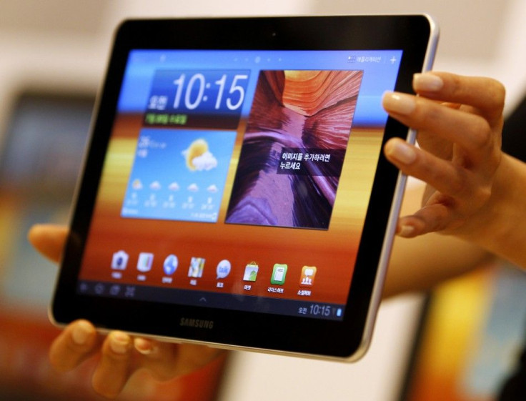 A model holds a Samsung Electronics' new tablet 'Galaxy Tab 10.1' during its launch ceremony at the firm's headquarters in Seoul
