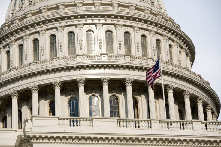 The U.S. flag flutters in the breeze at Capitol Hill in Washington