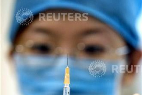 A Chinese doctor prepares a vaccination injection against meningitis at a disease prevention station..