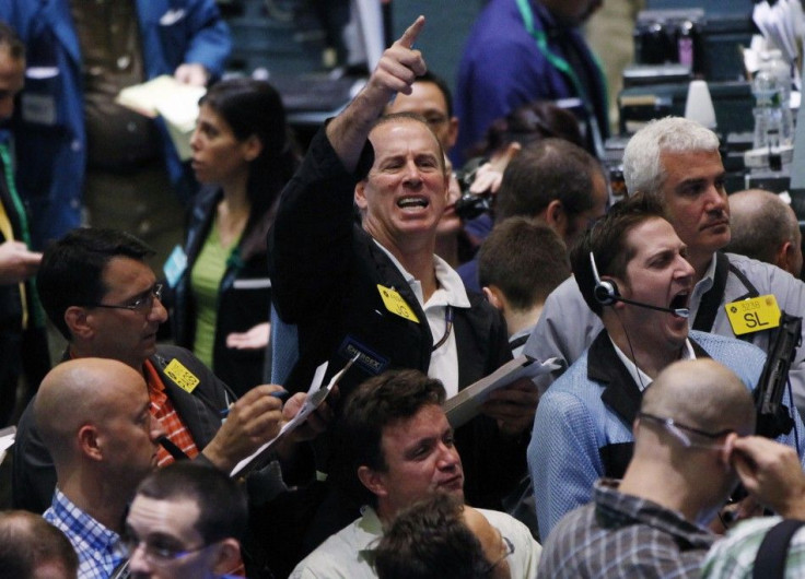 Traders work in the crude oil and natural gas options pit on the floor of the New York Mercantile Exchange in New York