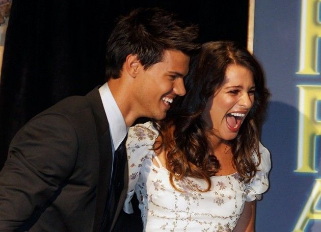 Actress Michele escorts actor Lautner to the stage at the HFPA Annual Installation Luncheon in Beverly Hills 