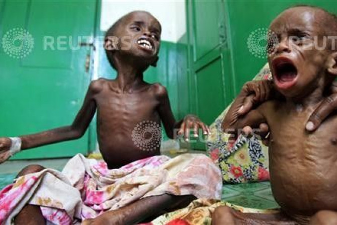 Malnourished Somali children cry inside a paediatric ward at the Banadir hospital in Mogadishu