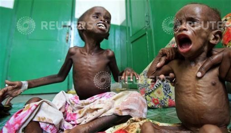 Malnourished Somali children cry inside a paediatric ward at the Banadir hospital in Mogadishu