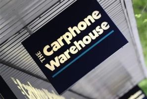 A Carphone Warehouse sign hangs outside a branch in west London