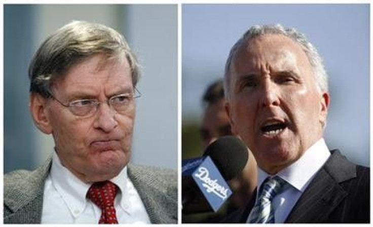 Major League Baseball commissioner Bud Selig (L) and Los Angeles Dodgers owner Frank McCourt are shown in this combination of file photos