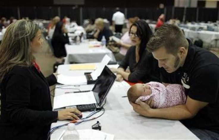 Rebecca Esquibel, 30, and Nathan Glidden, 29, and their one-month-old daughter Aliyah at a Bank of America mortgage modification outreach event in Los Angeles