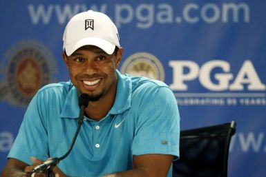 Tiger Woods talks to the media during his news conference before the start of the 93rd PGA Championship golf tournament at the Atlanta Athletic Club in Johns Creek