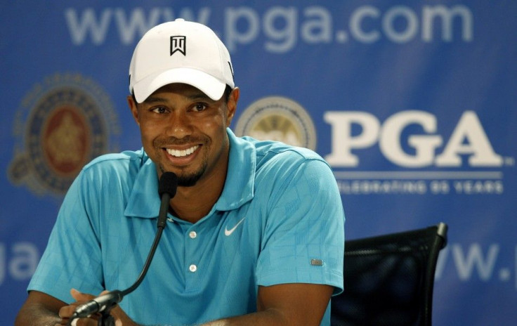 Tiger Woods talks to the media during his news conference before the start of the 93rd PGA Championship golf tournament at the Atlanta Athletic Club in Johns Creek