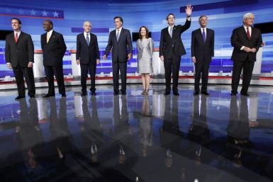 U.S. Republican presidential candidates gather before the start of their debate in Ames