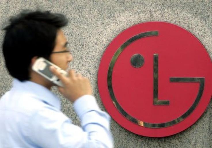 A man walks past a LG Electronics logo at the company's headquarters in Seoul