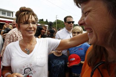 Former Governor of Alaska Sarah Palin greets people during a visit to the Iowa State Fair in Des Moines, Iowa