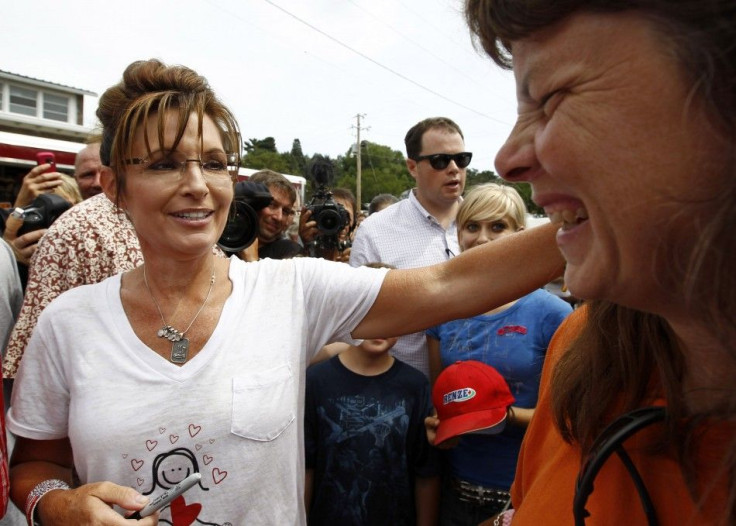 Former Governor of Alaska Sarah Palin greets people during a visit to the Iowa State Fair in Des Moines, Iowa