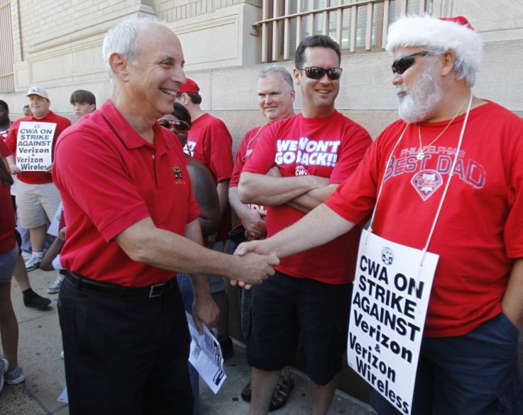 Communications Workers of America President Cohen shakes hands with Verizon workers in Philadelphia