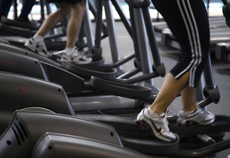 Clients work out on machines at the Bally Total Fitness facility in Arvada