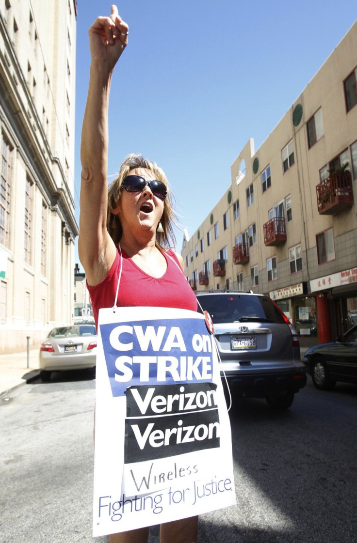 Verizon worker shouts while picketing at the Verizon office on ninth street in Philadelphia