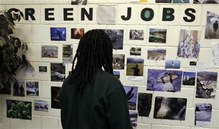 Student Brian Goode looks at pictures of green jobs on a wall at the Youth Opportunity (YO!) Academy and the Westside Youth Opportunity Community Center in Baltimore