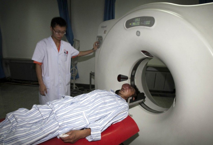 Fei Jianjun, 40, who suffered from rhinocarcinoma, receives a CT scan at a hospital in Changchun