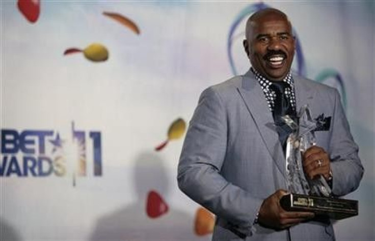TV personality Steve Harvey poses with the BET humanitarian award he received at the 2011 BET Awards in Los Angeles