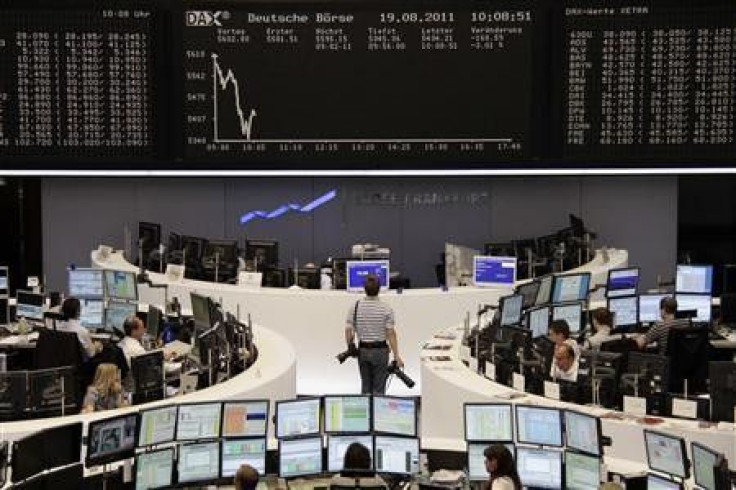 A photographer looks at the DAX index board at Frankfurt&#039;s stock exchange