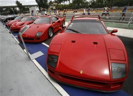 Ferrari cars, including the F40 (R and 2nd R), F50 (2nd L) and Enzo sit on display during a show of luxury cars in Singapore