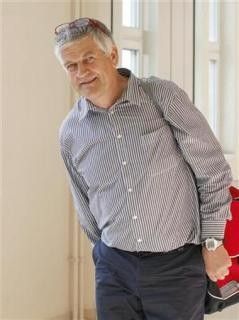 Former Head Coach of Austrian Nordic Skiing and Biathlon team Walter Mayer arrives at a courthouse for his trial on doping charges in Vienna
