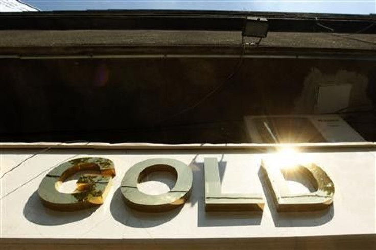 The logo of a gold jewellery shop is seen in Bucharest